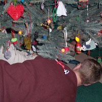don't lie under the christmas tree with anyone else but we!&nbsp; :D&nbsp; note the brilliant macaroni heart to the left....