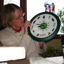 mom domonstrates each of the featured bug noises in my new clock