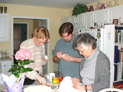 drawing on the eggs, with dennis taking the pictures.