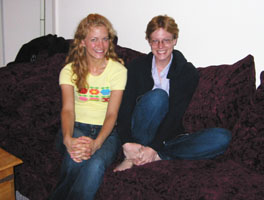 colleen and amy on the couch that was split in seven places