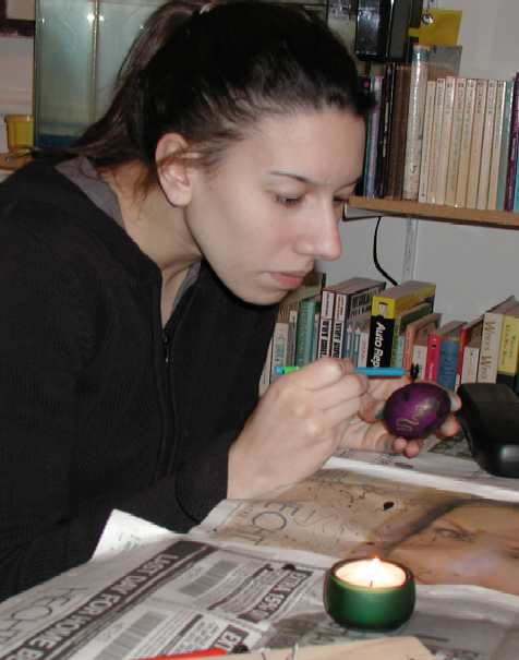 shhh...lizzie liz concentrates, drawing in wax on the egg