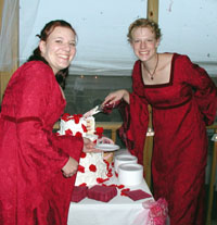 coll and emily dish out the cake...before that man came and pushed us out of the way!