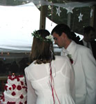 sunny and lucas cut the cake.... that i decorated with petals!