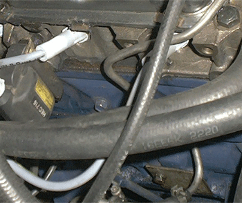 The coil and bracket must now be moved, so that the VK EFI throttle bracket (with AAV and damper) can be installed. Note only VK heads have the bolt holes for the coil to be relocated.
