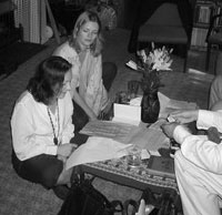 Amy, embroiled in hard work, as Rose looks on...