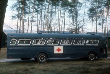 Blue Medical Bus in back of Northside Clinic