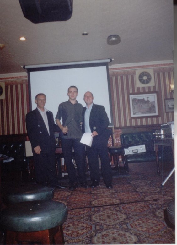 Gareth getting his trophy from the managers of the club (Tom and Nick).