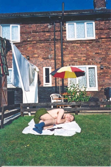 Mock-sleeping in my garden. Summer 2001.