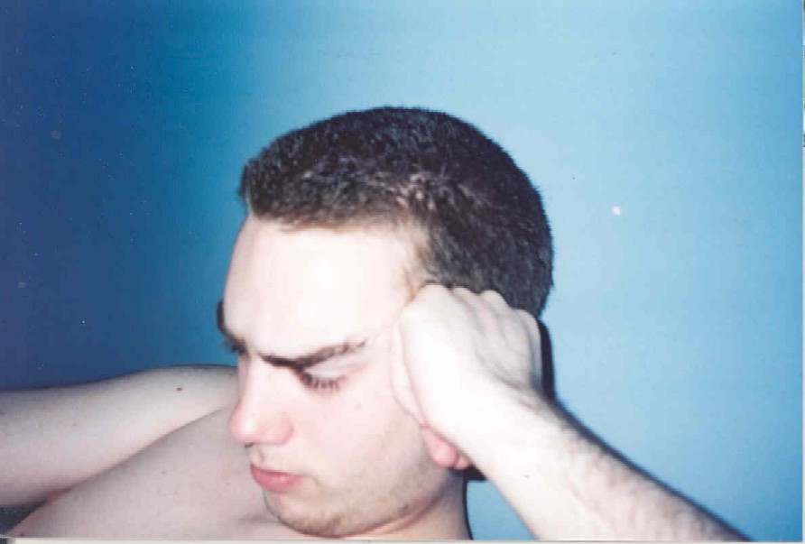 Me in my room looking scruffy. 2001?
