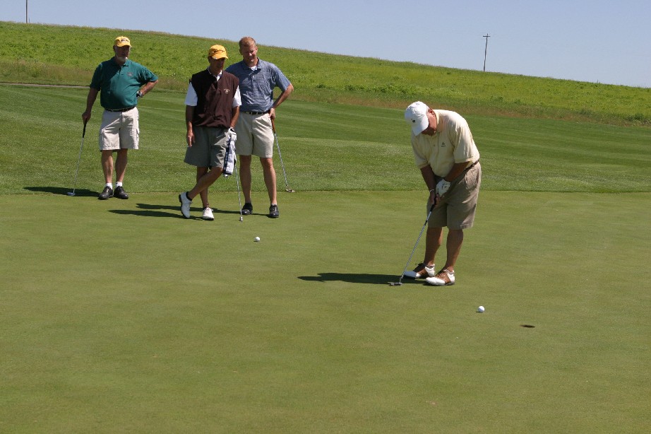 hint: look at the three men whatching what are they doing.