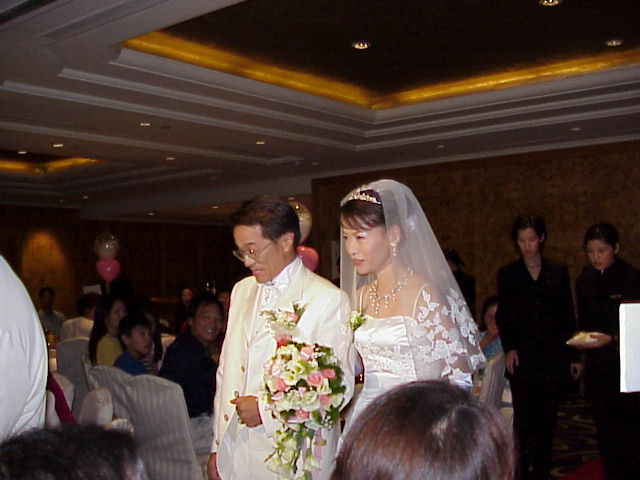 Bride and Groom walking down the aisle