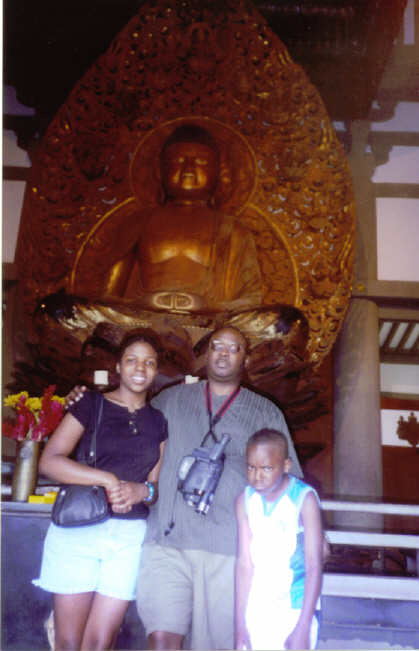 Me, Dad, and Bro in front of the Buddha statue at a Japanese Shrine