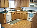 I designed, built, finished, and installed this kitchen for a private customer (Sarah's kitchen). Custom oak plywood cabinet doors, solid oak railings, white melamine interior.