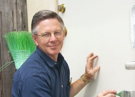 Rod putting a new back door on an apartment