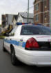 A squad car blocking the street
