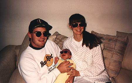 1990 - Craig, newborn Maxwell, and Kimberly, everyone's wearing sun glasses