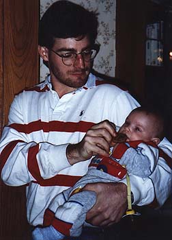 January 1991 - Craig feeding Maxwell a date pinwheel cookie