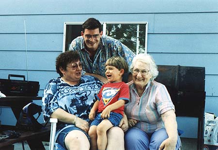 Grandma Iris, Craig, Maxwell, and Great Grandma Avis on Iris' patio