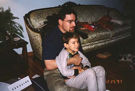 Christmas 1997 - Craig and Maxwell watching TV