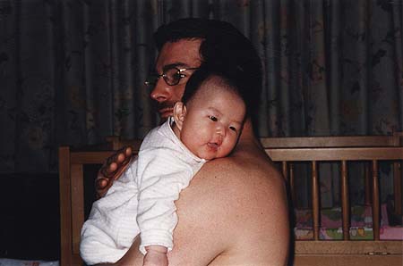 March 1998 - Craig holding Zoey at night