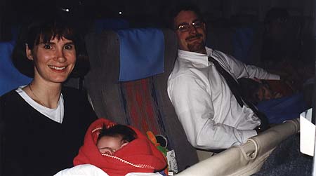 March 1998 - Kimberly, Zoey, Craig and Maxwell, flying home from Korea, the kids are sleeping