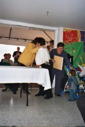 Mama Clara gets an award for her many years of service,caring for CRAN foster babies.