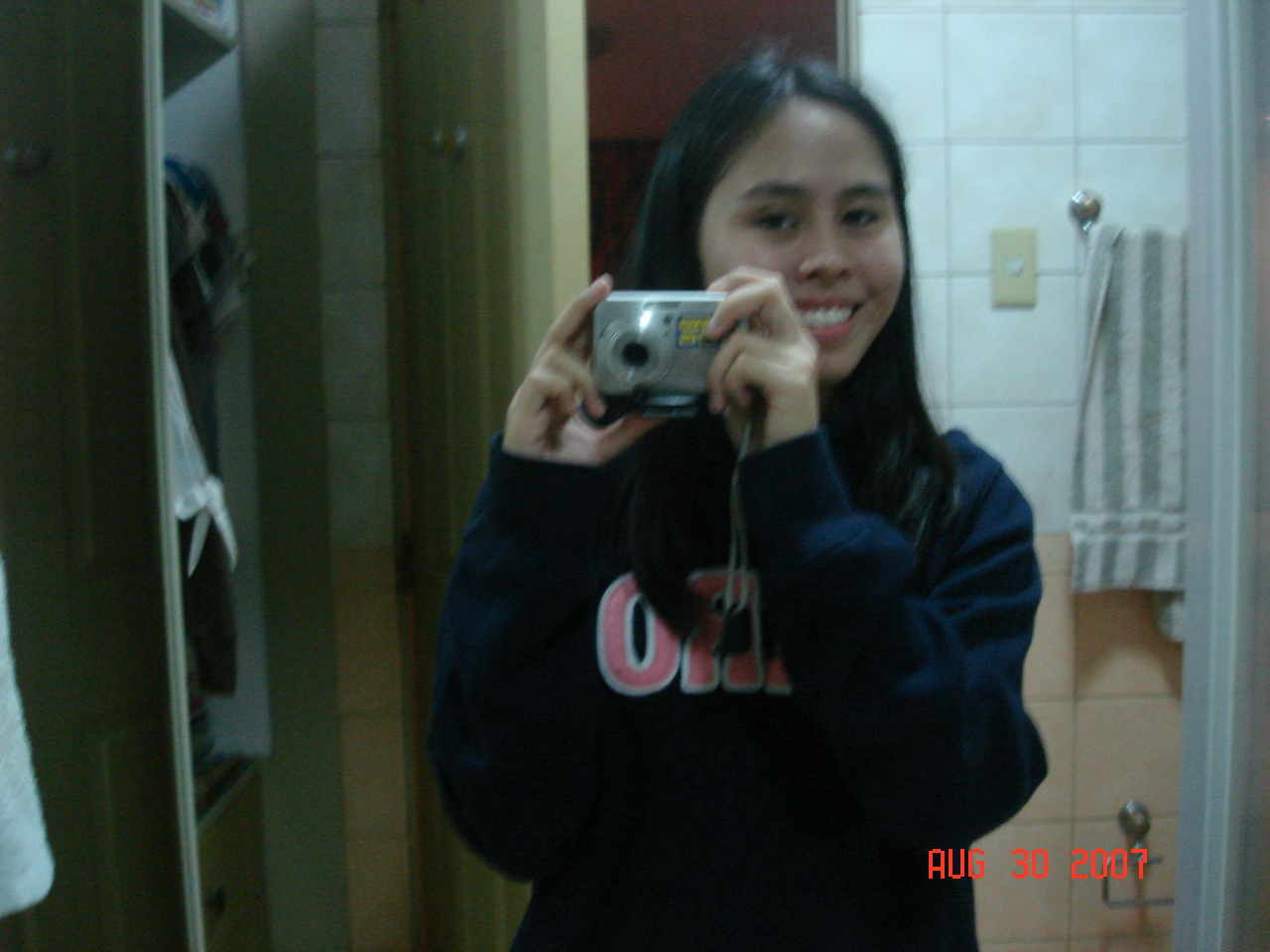 Janelle smiles as she takes her picture