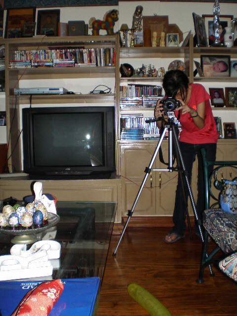 Klarisse looks like a professional photographer with her SLR camera