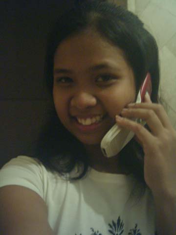 Kristine striking a pose with her cell phone