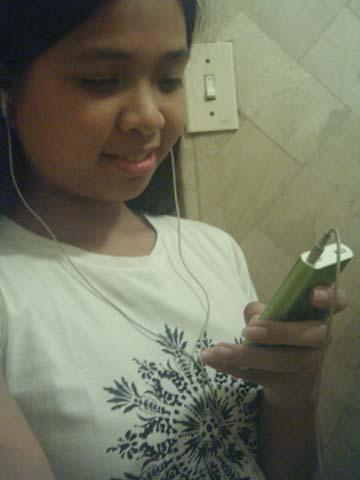 Kristine listening to her iPod
