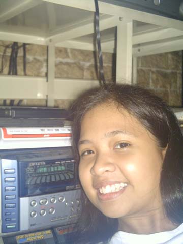 Kristine taking her picture with the music player