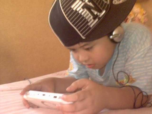 Janelle's brother, Justin Ryan, playing his PSP
