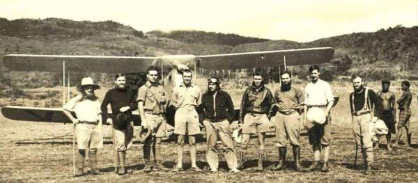 1932 photograph at Mt Hagen of a Guinea Airways DH and chief pilot Bob Gurney (centre with goggles on forehead) and on his right Mick Leahy and Danny Leahy and on his left Jim Leahy, the others are German catholic missionaries.