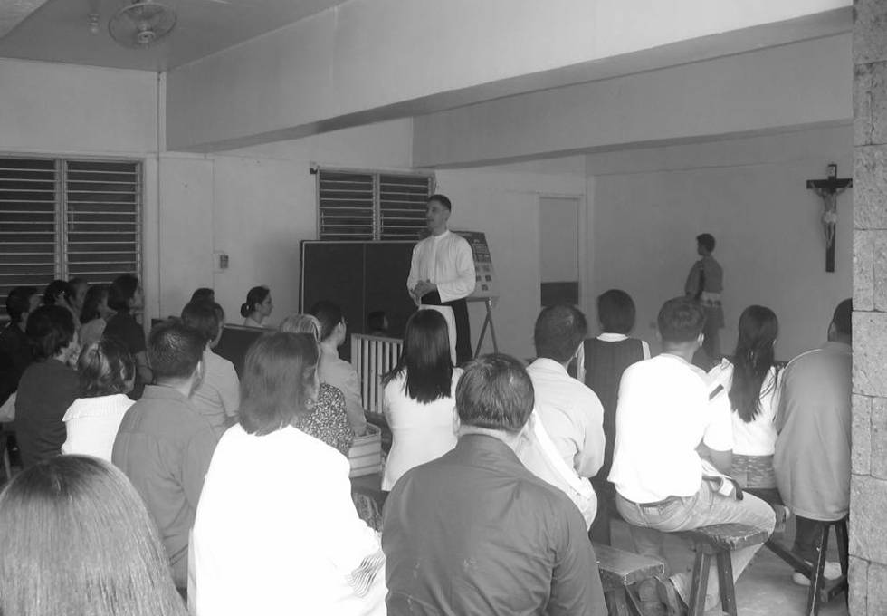 The church basement hall where the Catechism classes for adults are held every Sunday after the 9:00 am Sung Mass.
The former prior, Fr. Vicente Griego is seen here conducting one of these Sunday classes. This hall is also a place for various church activities such as symposia, conferences, pot-luck dinners, exhibits, medical missions, etc.
