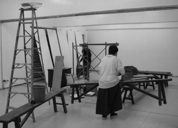 Fixing the interior of the classrooms; the planks of wood in the background will be used for the accordion-type partition that will divide the room�it is of this type for easy collapsing when both rooms will be used for a parish activity.