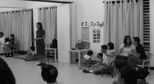 Ms. Michelle Azucena, one of the teachers, delivers her thank-you speech to the priests and parents, as well as to the volunteers who helped in finishing the classroom decorations and other necessary things inside the school.