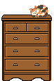 Cat playing in dresser