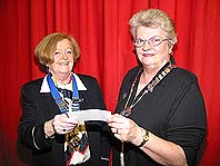 Crossgar WI President, Sheila McMurray, presents a cheque to NI Federation Chairman, Joan Shanks