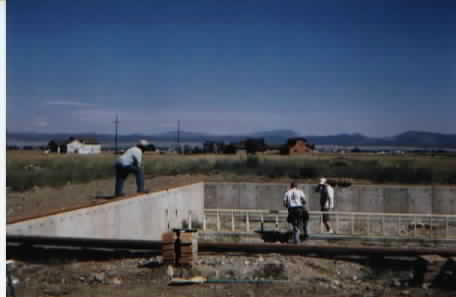 Installing the footings for the basement of the gym.