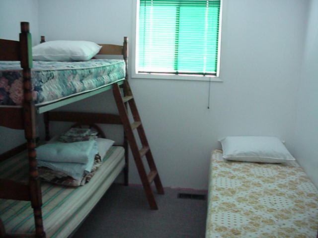 Bedroom with 1 bunk & 1 single bed.