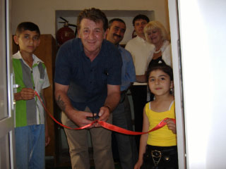 Dave Walls cuts the ribbon at the Lokbatan Sanatorium
