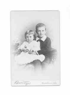 
Fred seated with arms aroung his younger sister
