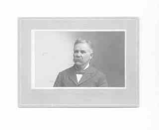 
Issac (from chest up) in suit, bowtie, and mustache (landscape format)
