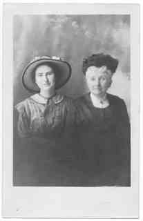 
Milly in flowerd hat; Emma in mourning clothes(?)
