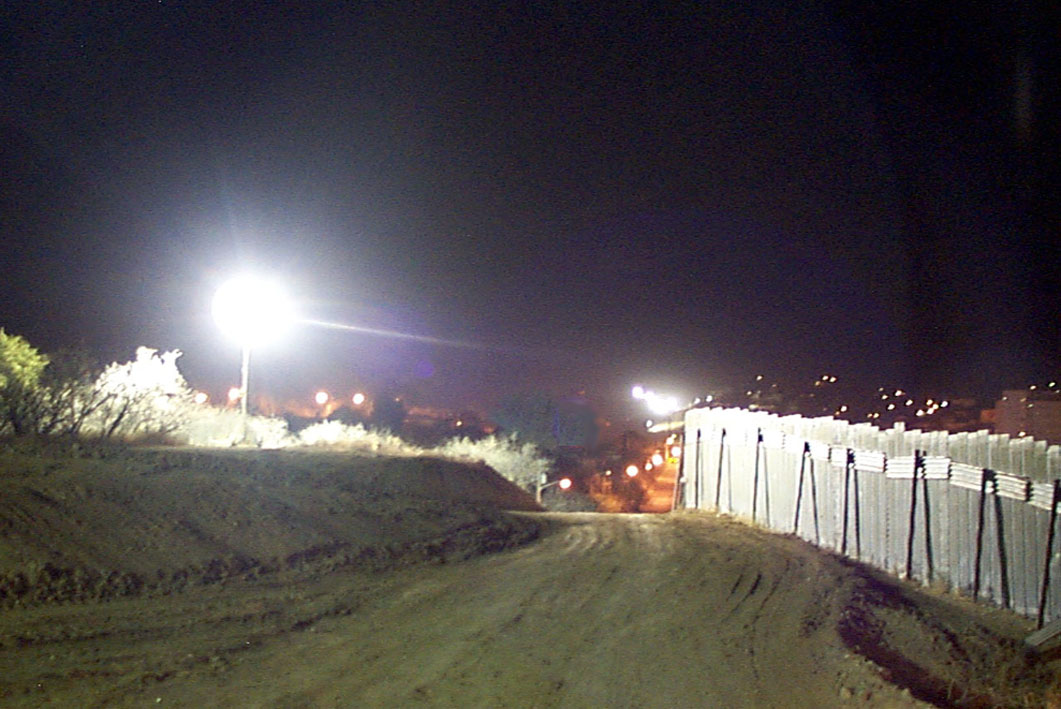 A generator lights up the border fence