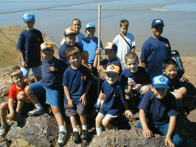 with the Bay as a backdrop, these cub scouts enjoy reaching the top of Red Hill Top