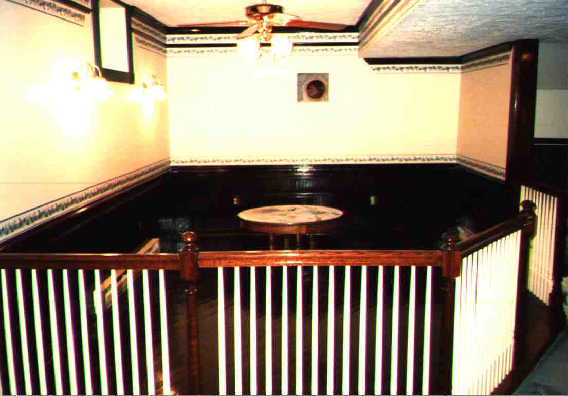 Part of the basement area, a stage area for Jerry (or a pool table area).&nbsp; Lots of molding here, too.