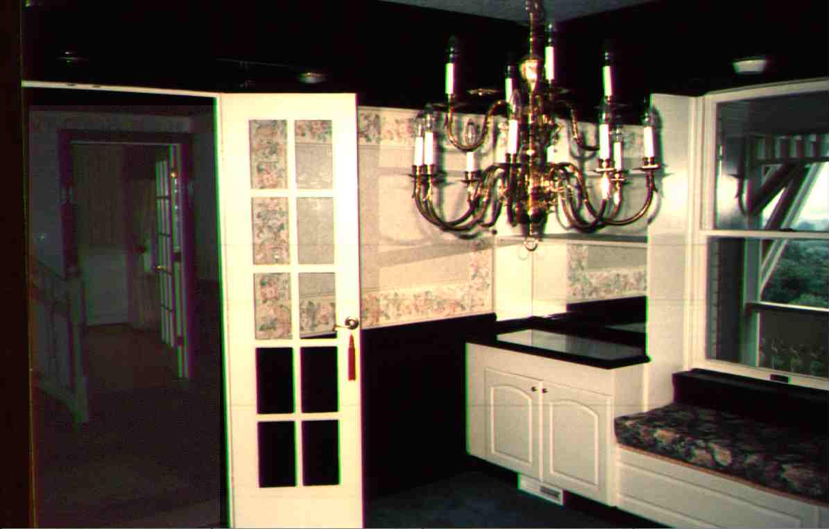 A beautiful brass chandelier, recessed lighting, and LOTS of molding.&nbsp; Just off the tiled foyer, and next to kitchen.
