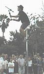 Flaming torches while on a 15 foot unicycle (and no helmet!)