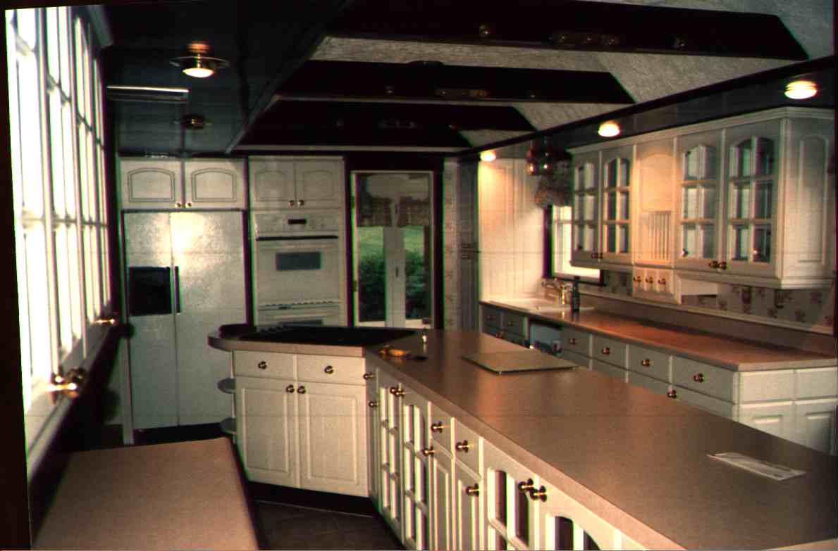 A kitchen for Martha Stewart.&nbsp; 26 feet long with tons of cabinets and counter space.&nbsp; Tiled floor, tiliing on wall, recessed lighting. .&nbsp; A "sortof" cathederal ceiling with beams to hang pots.&nbsp; Double convection oven.